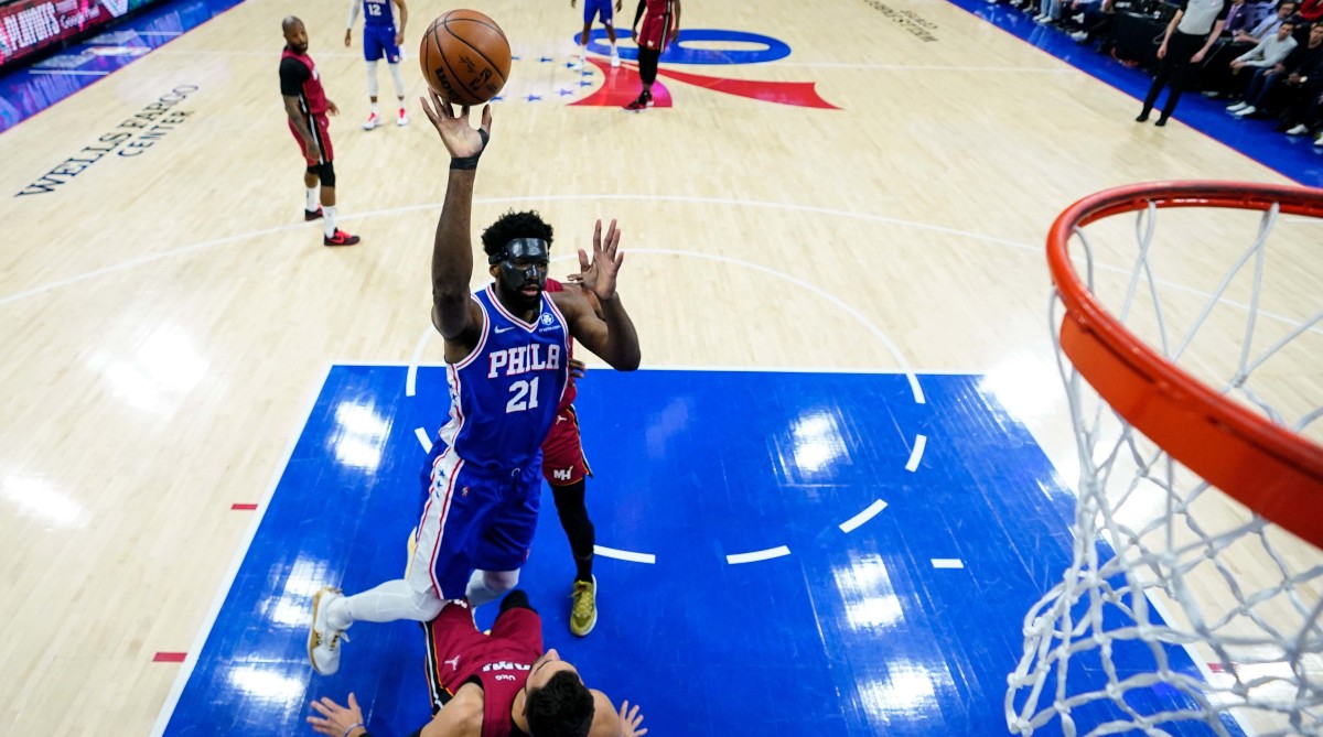 Philadelphia 76ers’ Joel Embiid goes up for a shot against Miami Heat’s Max Strus during the first half of Game 3 of an NBA basketball second-round playoff series, Friday, May 6, 2022, in Philadelphia.